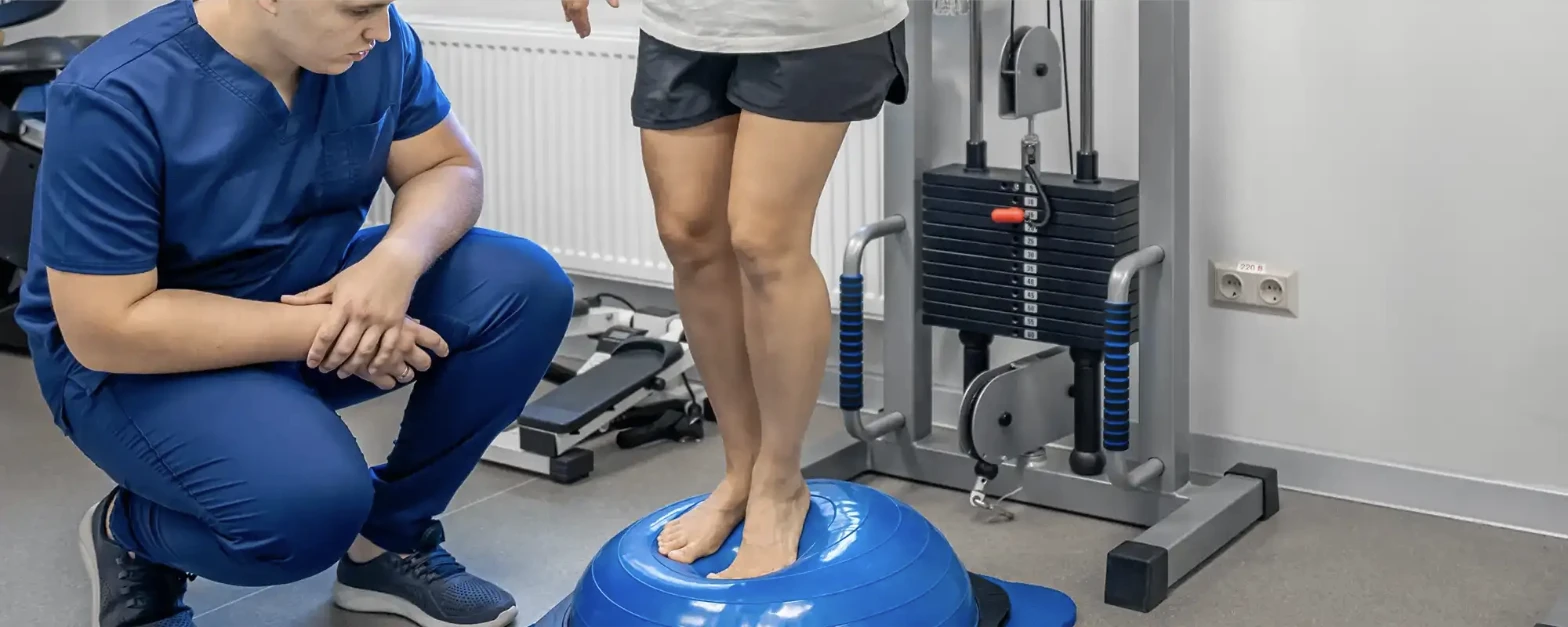 Physical therapist guiding a patient through a balance and gait exercise
