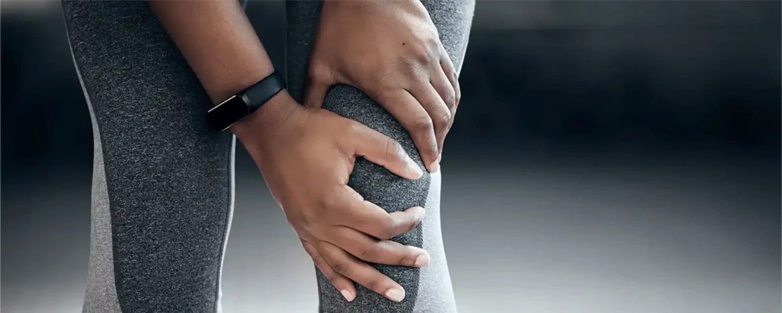 Physical therapist assessing a patient's knee mobility