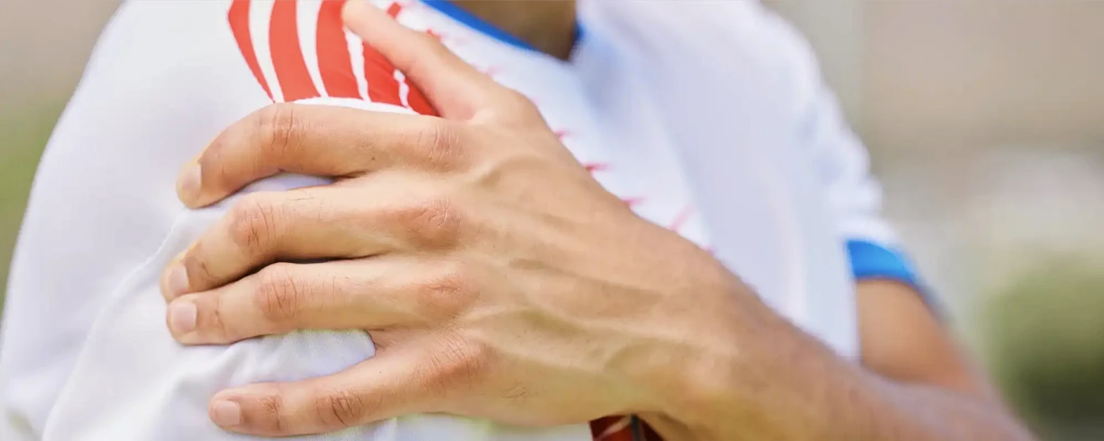 Physical therapist assessing a patient's shoulder and rotator cuff