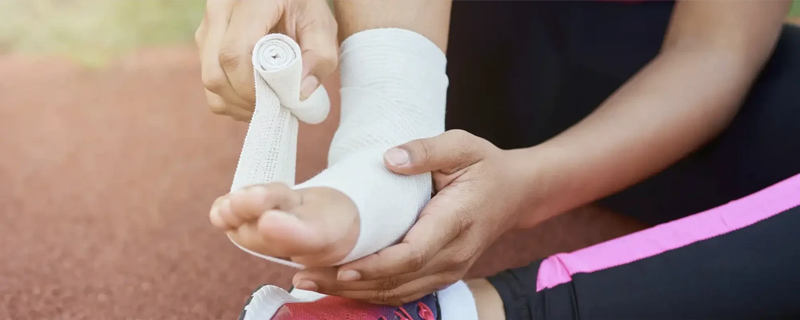 Physical therapist assessing an athlete's sports injury