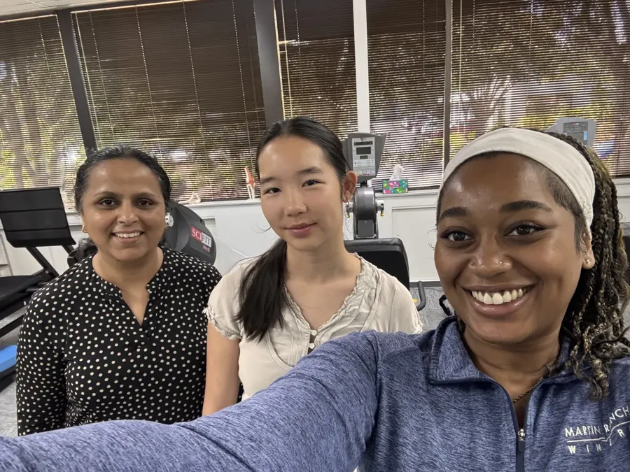 Summer intern with Cupertino Physical Therapy staff in the clinic gym