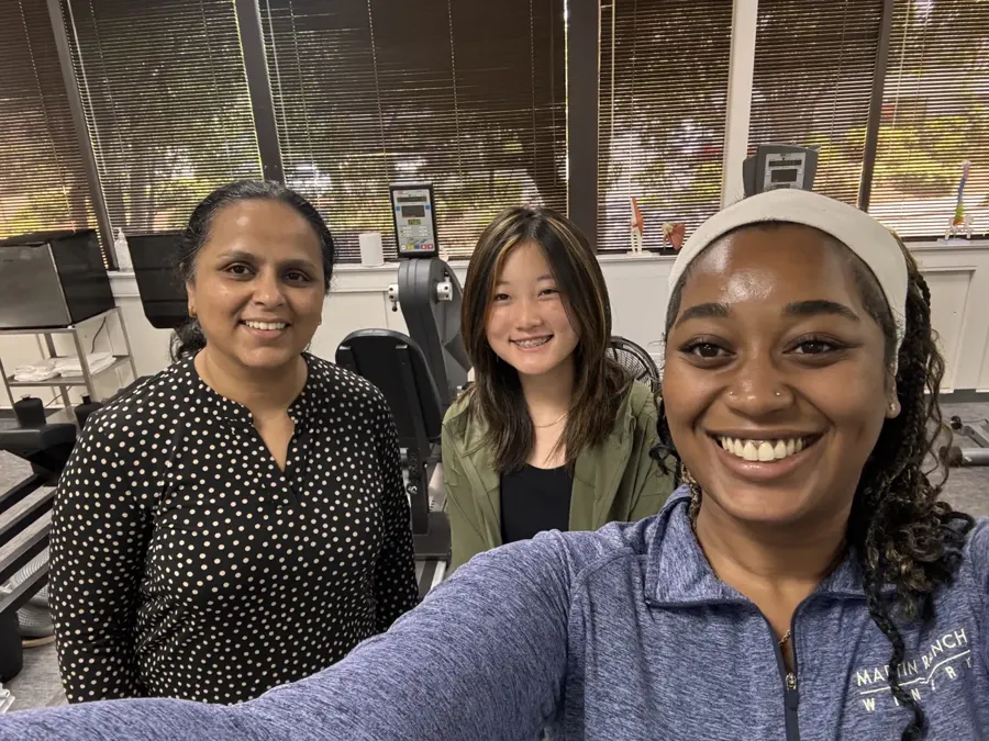 Summer intern with Cupertino Physical Therapy staff in the clinic gym