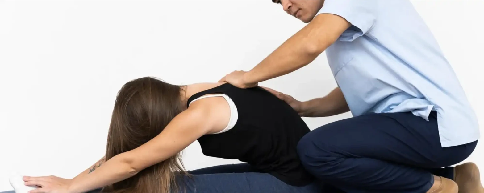 Physiotherapist treating a patient's upper back and neck