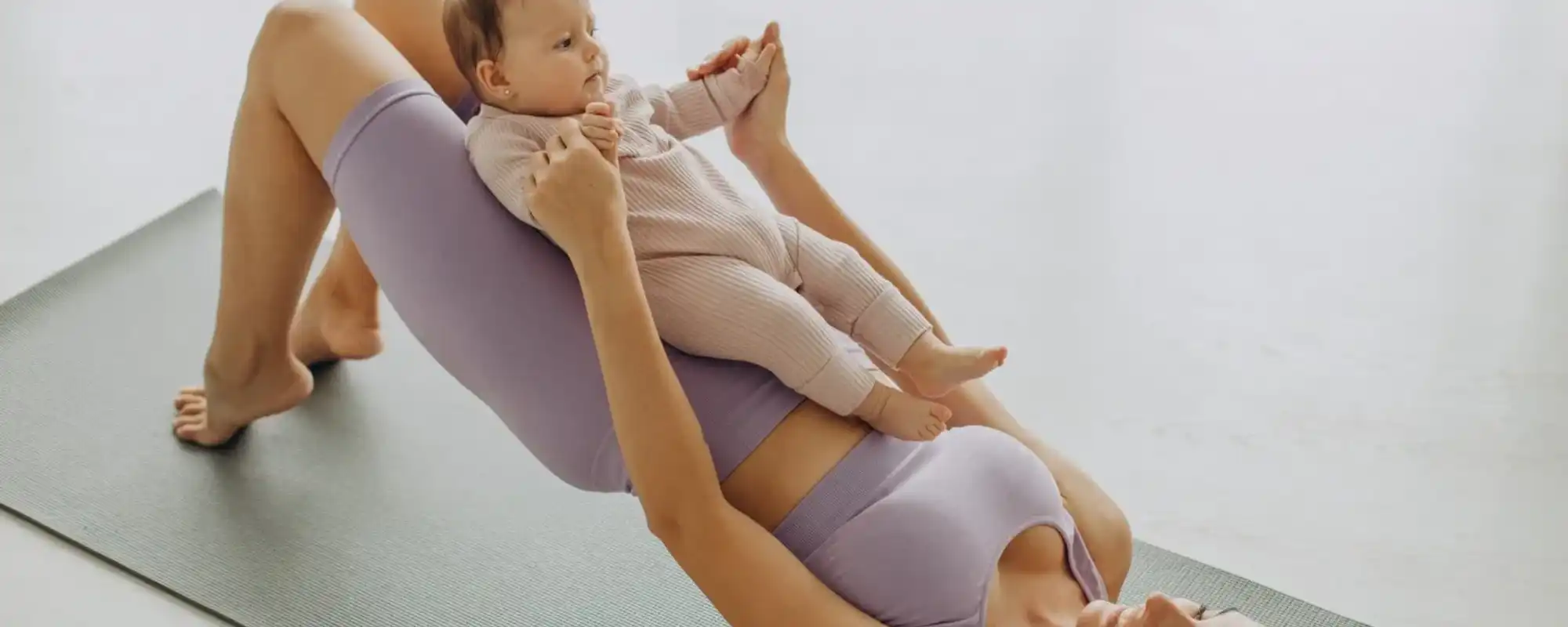 mother-with-her-baby-daughter-practice-yoga-home_1303-29043 (1) (1)